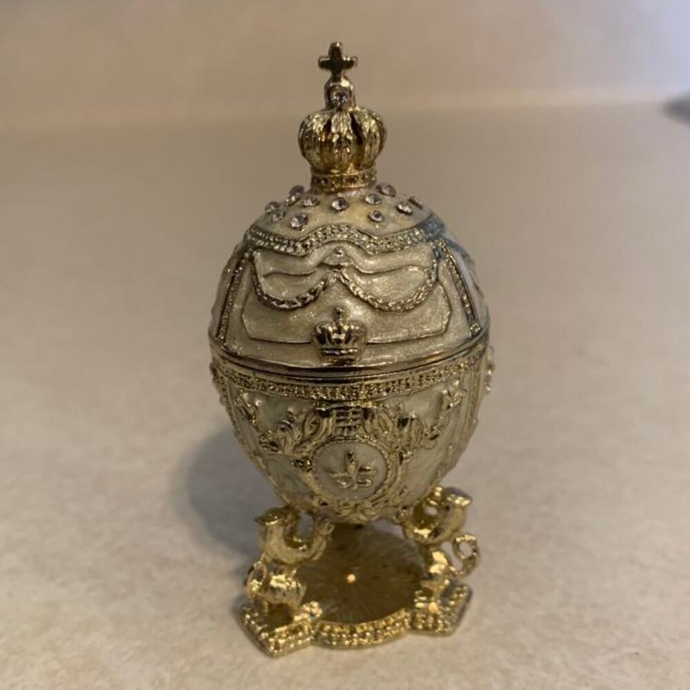New embellished egg trinket box. Rhinestone accents. Magnetic closure. 2  7/8"